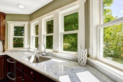 stone finished countertop with sink and cabinets